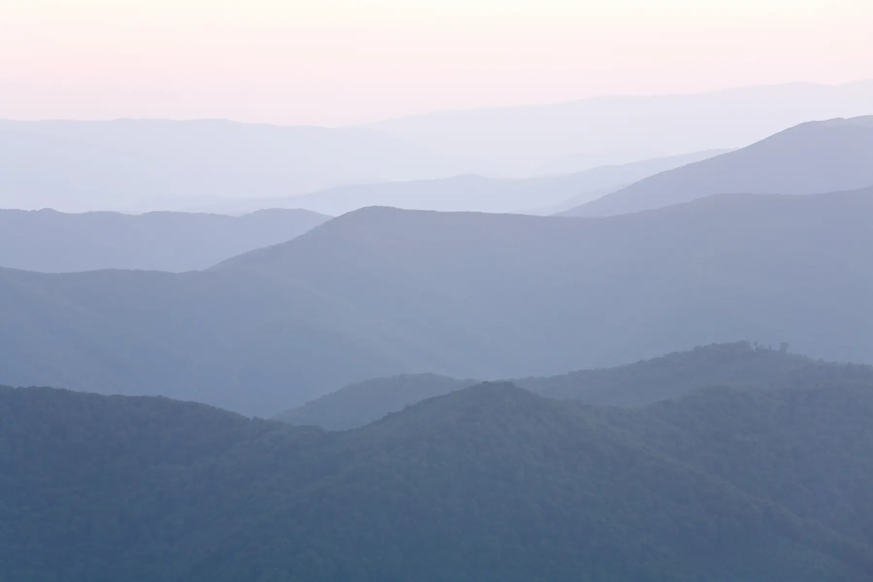 Ridge lines layered in haze, one behind another